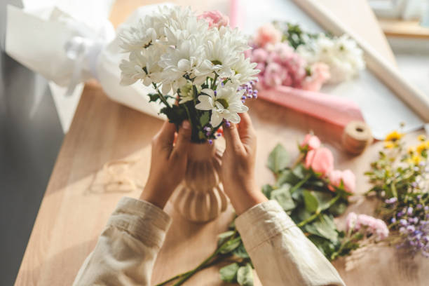 istock Florist at work. Woman making autumn floral decorations 1771437767