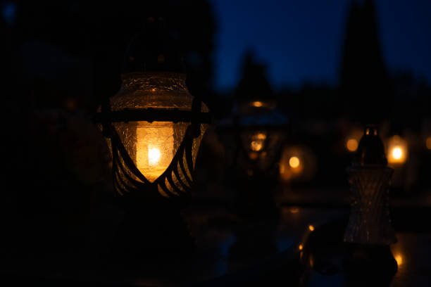 istock Candles in the cemetery at night 1771437800