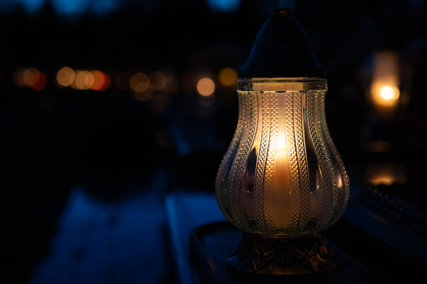 istock Candles in the cemetery at night 1771438336