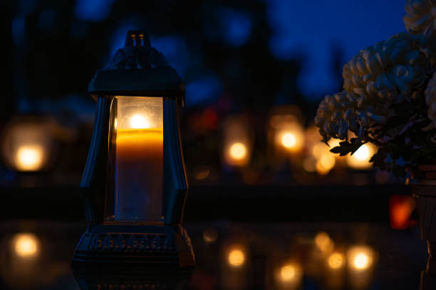istock Candles in the cemetery at night 1771439932