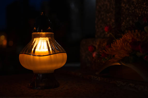 istock Candles in the cemetery at night 1771441632