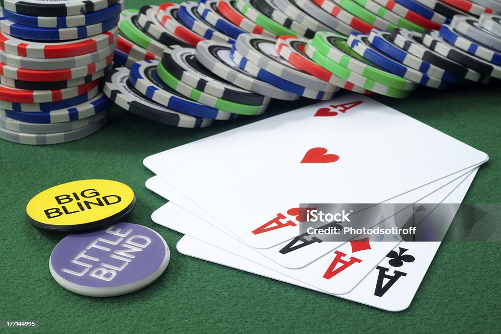 Four aces and chips on a green felt Casino Stock Photo