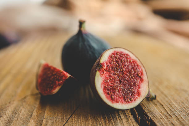 istock A few figs in a bowl on an old wooden background. 1771453738