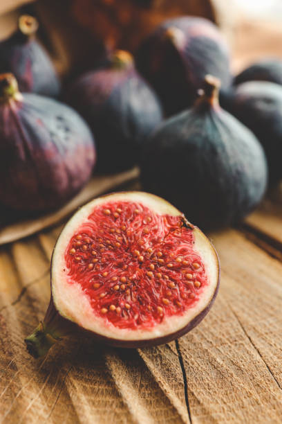 istock A few figs in a bowl on an old wooden background. 1771453742
