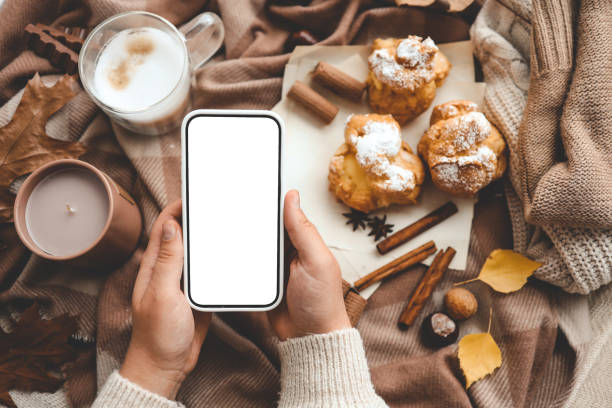 istock Phone with an isolated screen in hands, autumn mood 1771455434