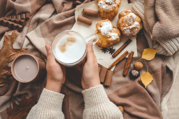 istock Cup of coffee in hands, cozy autumn 1771455436