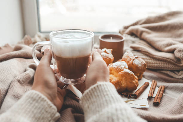 istock Cup of coffee in hands, cozy autumn 1771457070