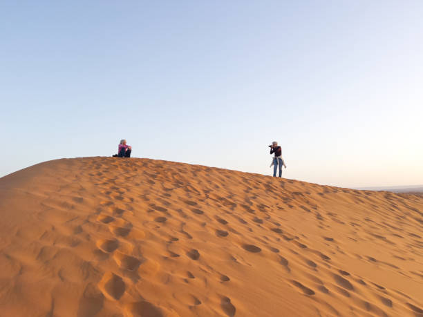 istock IMG_4081 Couple on a Saharan sand dune 1771464922