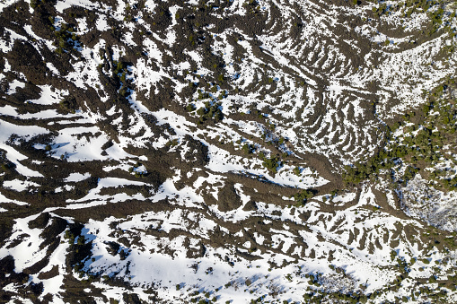 Aerial view of volcanic rock and snow in La Araucania region, Chile Patagonia