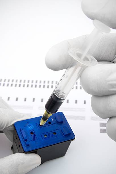 istock Cartridge refuelling with the syringe 177148701