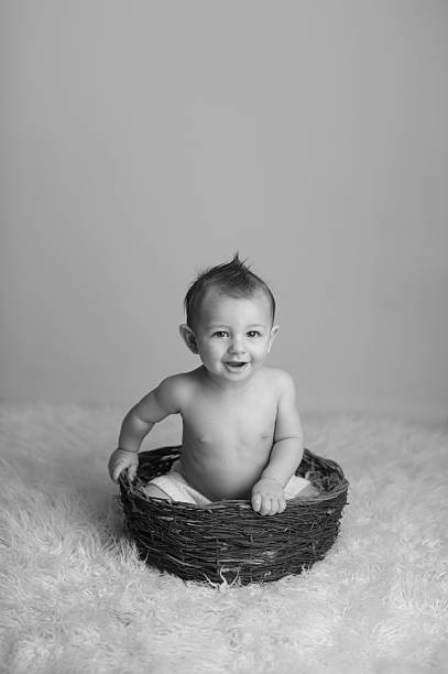 istock Smiling Baby Sitting in Basket 177148749
