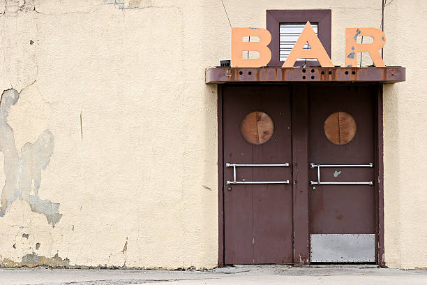 A door and a bar sign above it stock photo