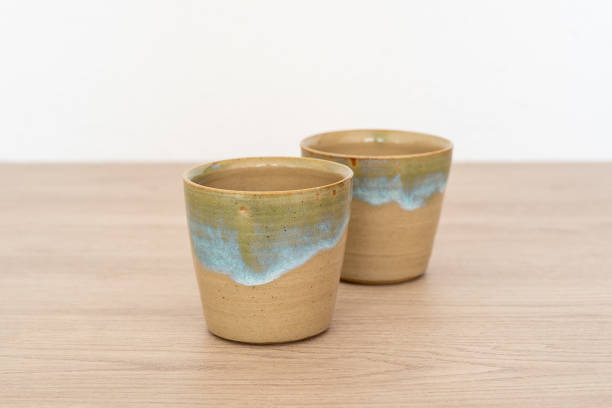 istock Two coffee cups on a wooden table 1771540535