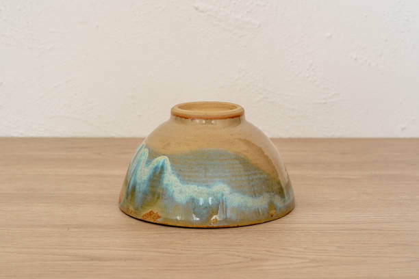 istock A glazed handmade bowl on a wooden table 1771540942