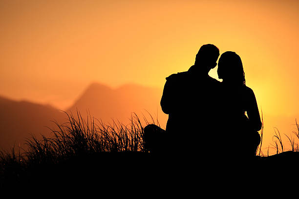 Couple enjoying sundowners Couple enjoying sundowners on the beach hermanus stock pictures, royalty-free photos & images