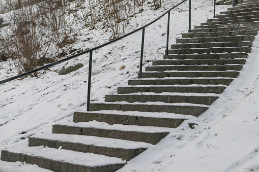 A abstract image of a set of outdoor stairs covered in snow.