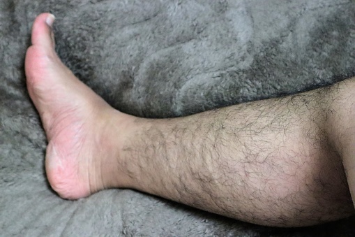 Close-up photo of hairy Japanese male legs