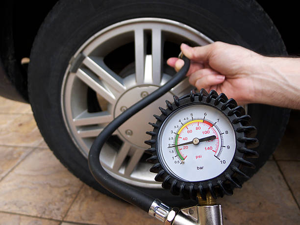 Checking Tire Pressure stock photo