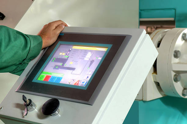 man operating factory machinery