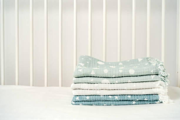 istock Stack of cotton blankets for a newborn in a cradle 1771704414