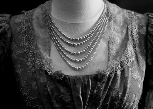 Black And White Detail Of Antique Edwardian Dress With Pearl Necklace