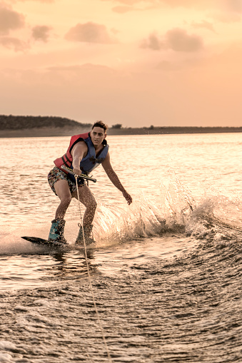 Wakeboarding, extreme aquatic sport.