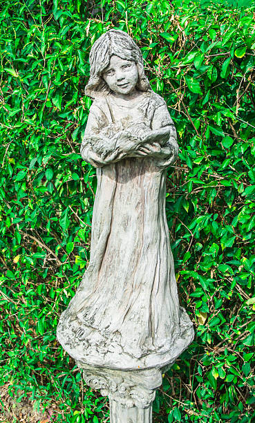istock girl prayer old statue 177179940