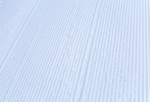 Freshly groomed empty ski slope close-up