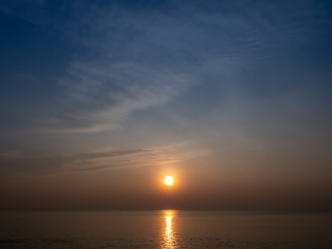 The Sunrise on The Cha-am Beach in Phetchaburi Province Thailand  with Peaceful