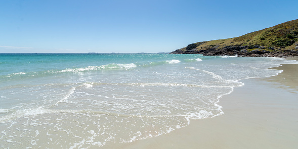 Puheke Beach with Crystal Clear Waters and White Sandy Shores with Coastal Rocks of Karikari Peninsula, Northland, New Zealand