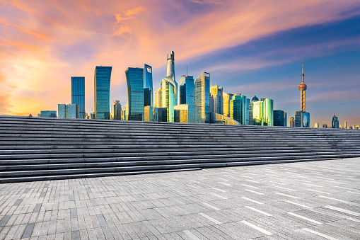 Clean square pavement and city skyline buildings background in Shanghai, China