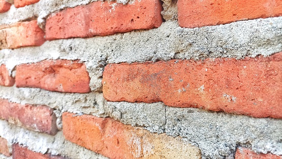 A selective focus, tight angle image of brick wall.