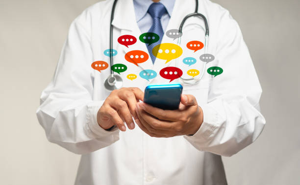 istock Doctor using a smartphone with colorful chat icons on application digital web and social media while standing in the hospital 1771940230