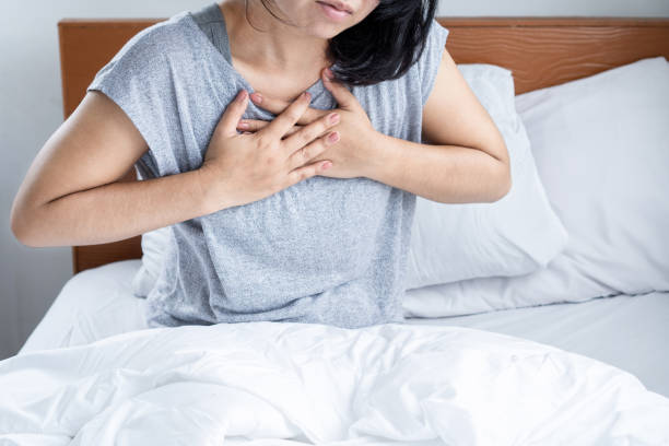 istock Asian woman suffering from chest pain, difficult to breathe , panic attack 1771951237