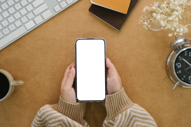 istock Office desk workspace desk. Cell phone with blank screen 1771956073