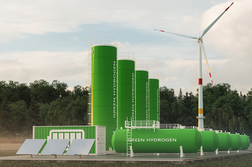 Green Hydrogen Storage Tanks, Solar Panels, Wind Turbine And Li-ion Battery Container In The Forest.Green Hydrogen Renewable Energy Production Concept