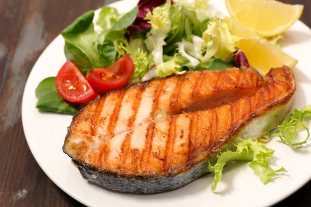 istock Grilled salmon steak piece with fresh lettuce 1771965074