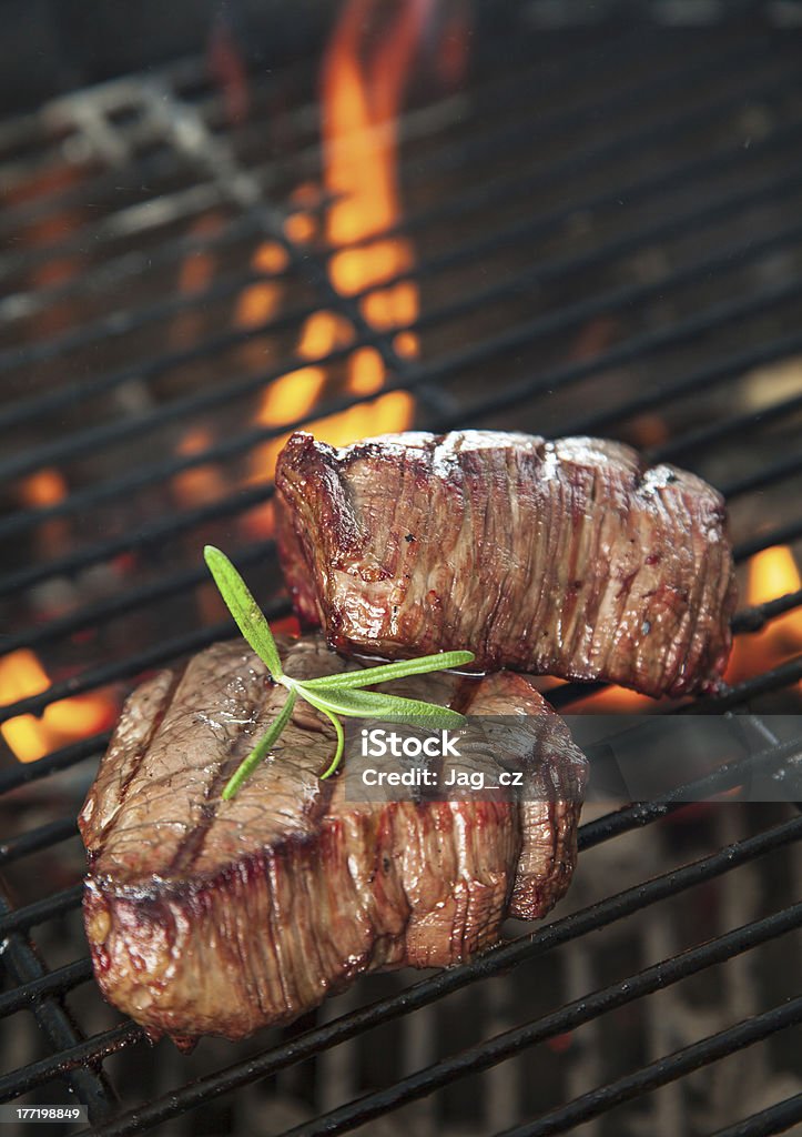Beef steaks Delicious beef steaks on grill Barbecue - Meal Stock Photo