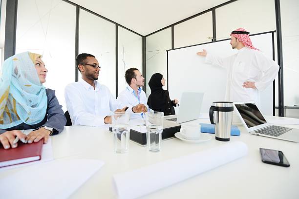 Middle eastern people having a business meeting at office stock photo