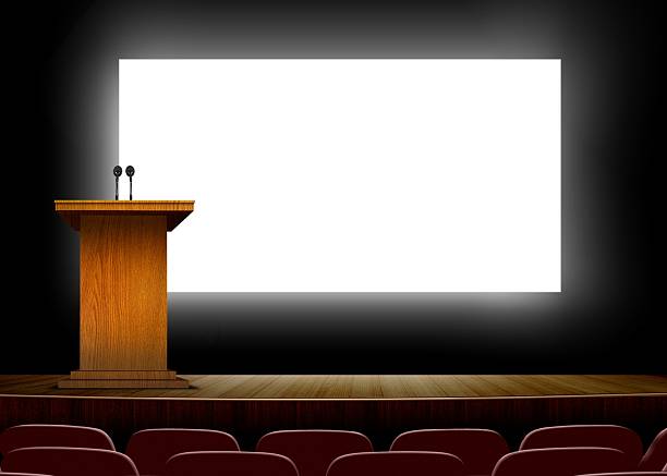 Bright presentation board behind podium in a conference hall stock photo