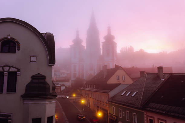morning pink light dawn over an ancient European town. Ancient city Mariazell Austria 10.2023