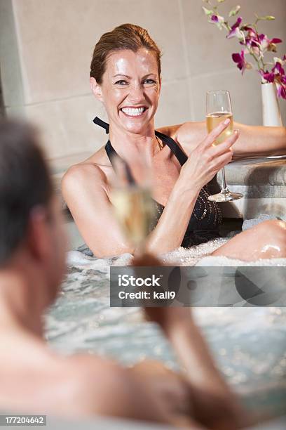 Mature Couple In Hot Tub Stock Photo - Download Image Now - 40-49 Years, 45-49 Years, 50-59 Years
