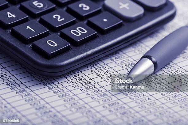 Closeup Of Pen And Calculator On Financial Report Stock Photo - Download Image Now - Adventure, Analyzing, Annual Event