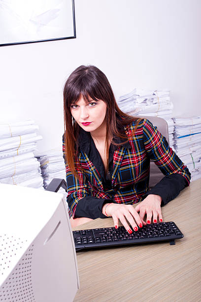 istock Young business woman typing on keyboard in office 177207094