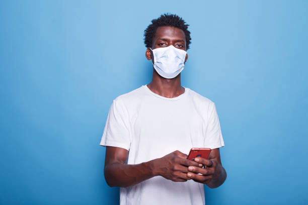 istock Man holds phone and looks at camera 1772079623