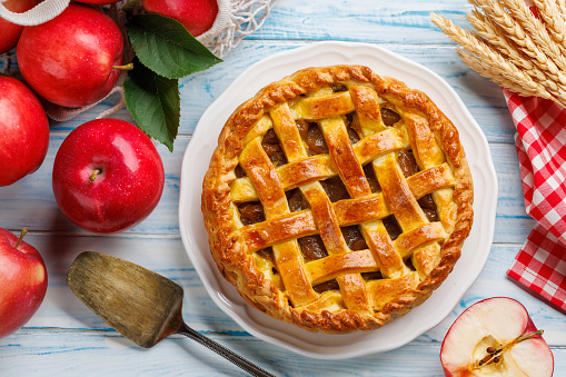 Delicious Apple Pie with Fresh Red Apples. Flat lay