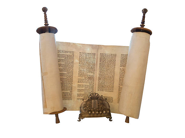 The Jewish Torah scroll and a gold menorah candle support The Jewish Torah scroll and a gold menorah candle support isolated over white torah photos stock pictures, royalty-free photos & images