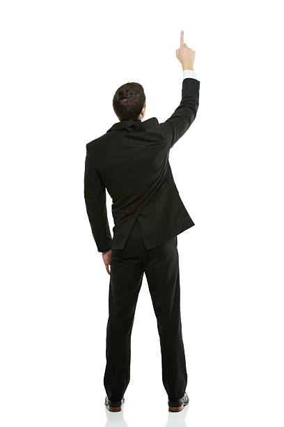 istock Rear view of a businessman pointing upward 177208422