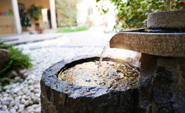 Traditional spring water fountain in garden