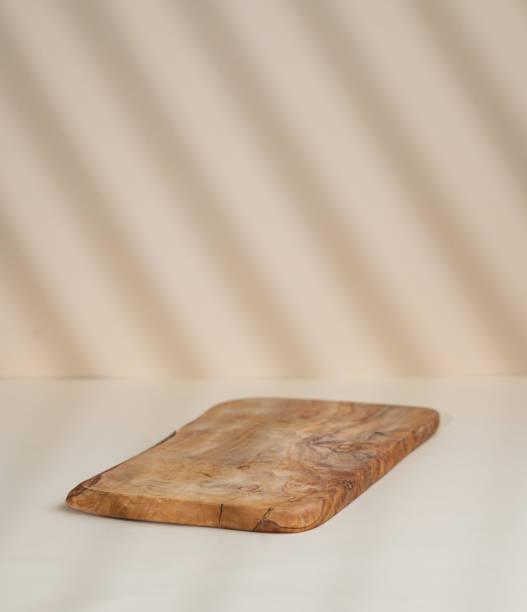istock Abstract empty wooden board with shadows on a beige background. Layout concept for promotional product presentation, sale or cosmetics display. 1772109649